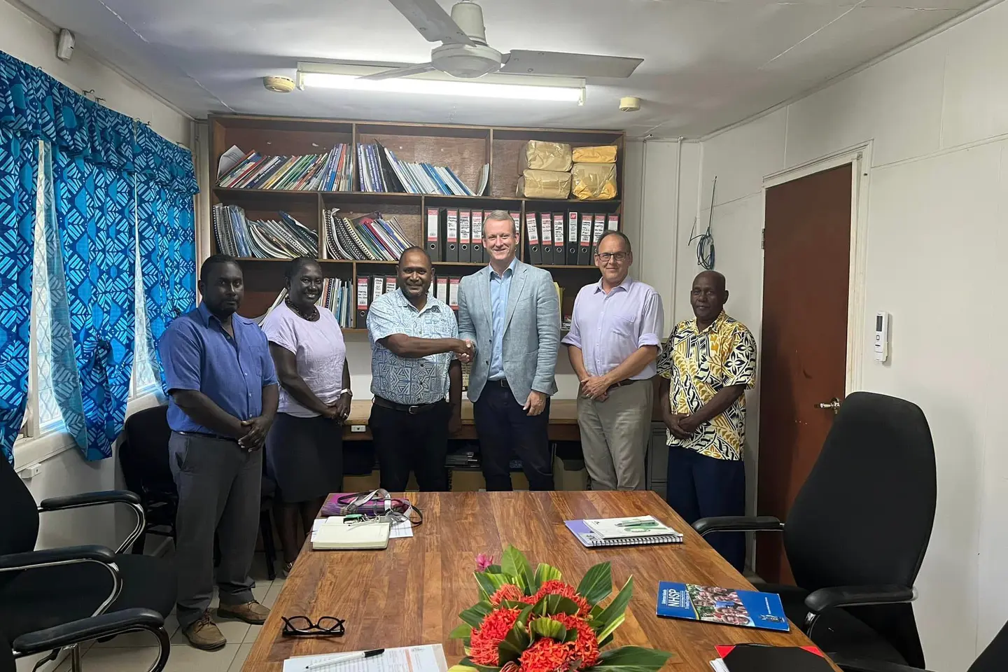 L-R Dr Gregory Jilini Deputy Secretary Health Care, Health PS Mrs. Pauline McNeil, Health Minister Dr Culwick Togamana and Australia High Commissioner to SI Mr. Rod Hilton shaking hands, Counsellor Human Development, Mr Mika Kontiainen and Director Policy and Planning Mr. Ivan Ghemu.