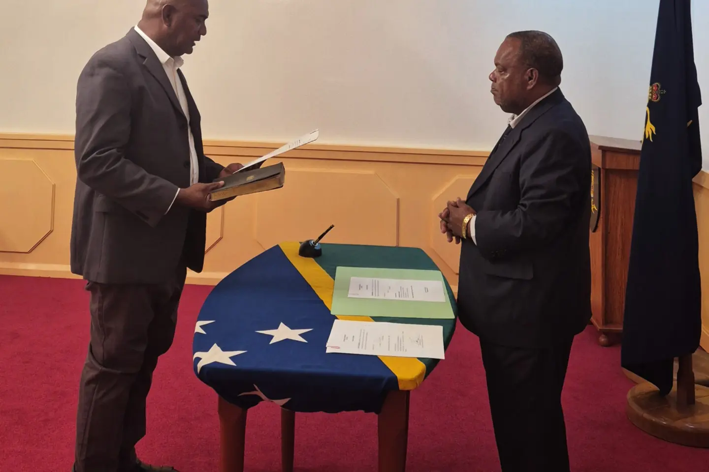 Simon Baete taking his oath before Governor General Sir David Tiva Kapu at Government House