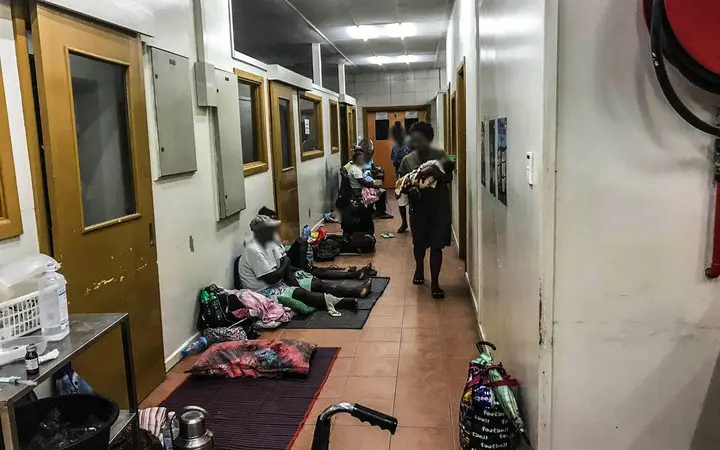 Patients wait along the corridor in the triage area of the National Referral Hospital in Solomon Islands.
