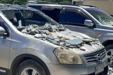 Vehicles damaged by fallen debris caused by the 7.3 magnitude earthquake.