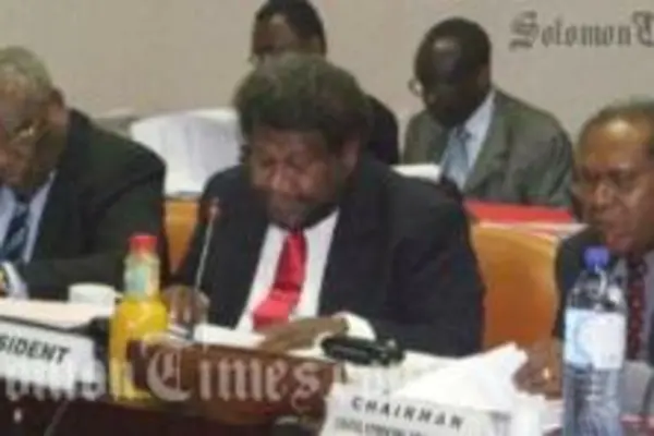 President of ACP Council of Ministers and Minister of Foreign Affairs of Solomon Islands, William Haomae, centre, addressing the meeting; Sir John Kaputin (SG ACP); and H.E Joseph Ma'ahanua.