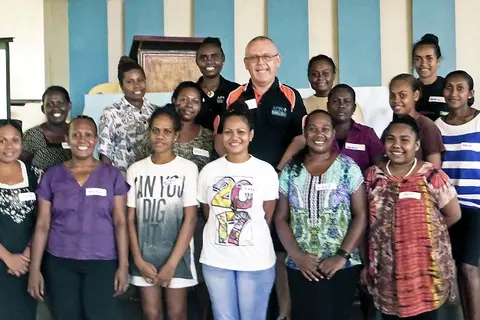 APTC Certificate III in Hospitality (multi-skill small accommodation) students with their trainer Mr William Hetherington and tutor, Ms Molina Kwato’o.