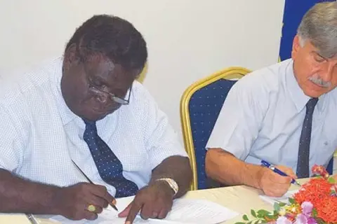 Minister for Development Planning and Aid Coordination, Hon Philip, left, and the EU Ambassador to Solomon Islands HE Tezapsidis sign the SBD$90-Million financing agreement.