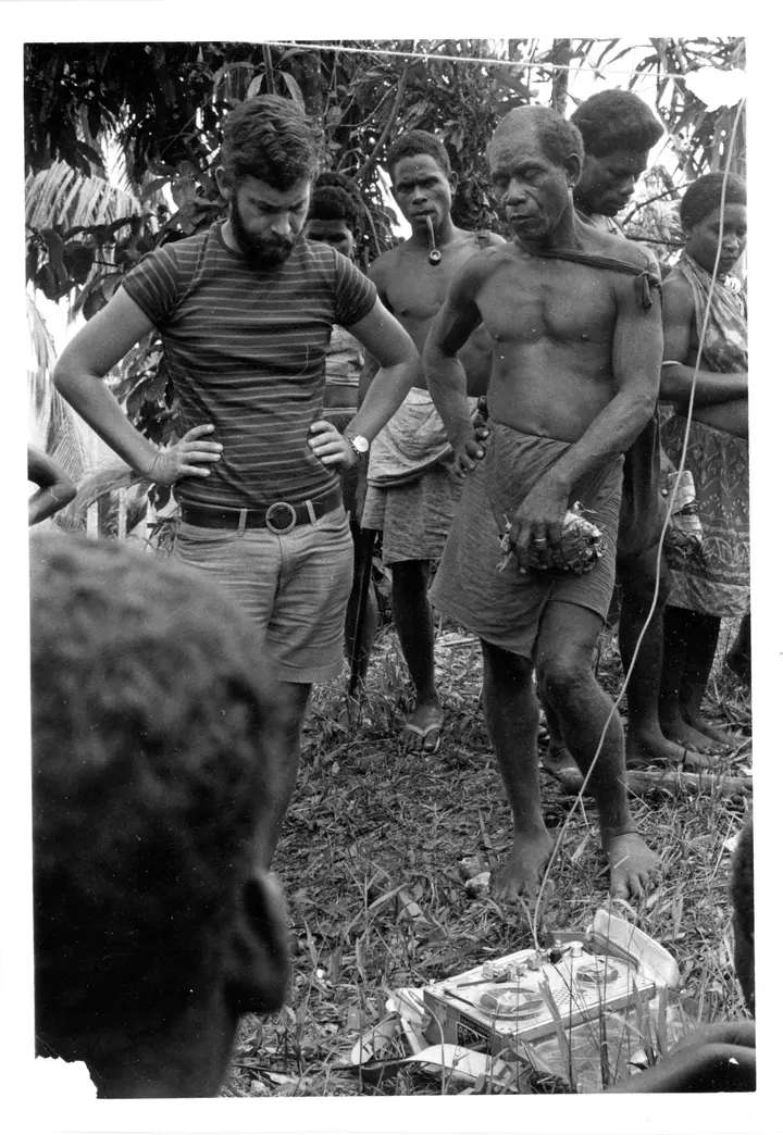 Hugo Zemp (left) with men beside his tape recorder on the east coast of Malaita, 1969.