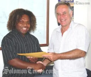 HE Mr Frank Ingruber, congratulating Mr Lamani on his selection and presenting him with travelling documents and other material for the internship.