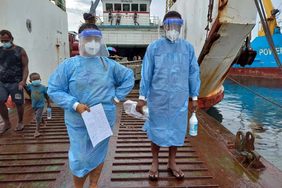 Volunteers at the wharf helping out with swabbing and COVID-19 testing using RAT kits for arriving passengers from the provinces.