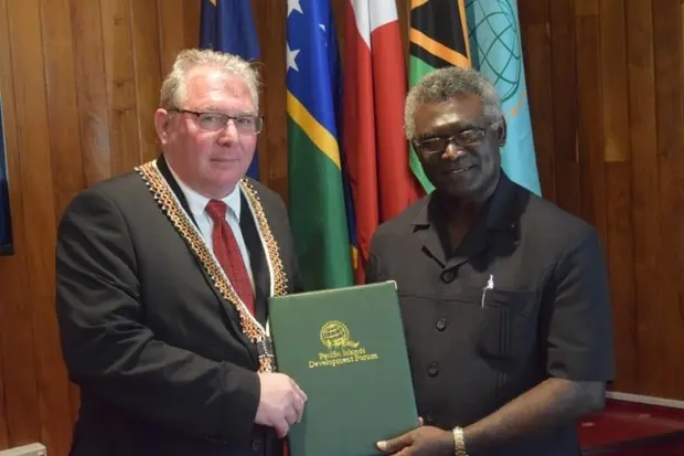 PIDF Secretary-General Francois Martel, (left), with Solomon Islands Prime Minister, Hon. Manasseh Sogavare.