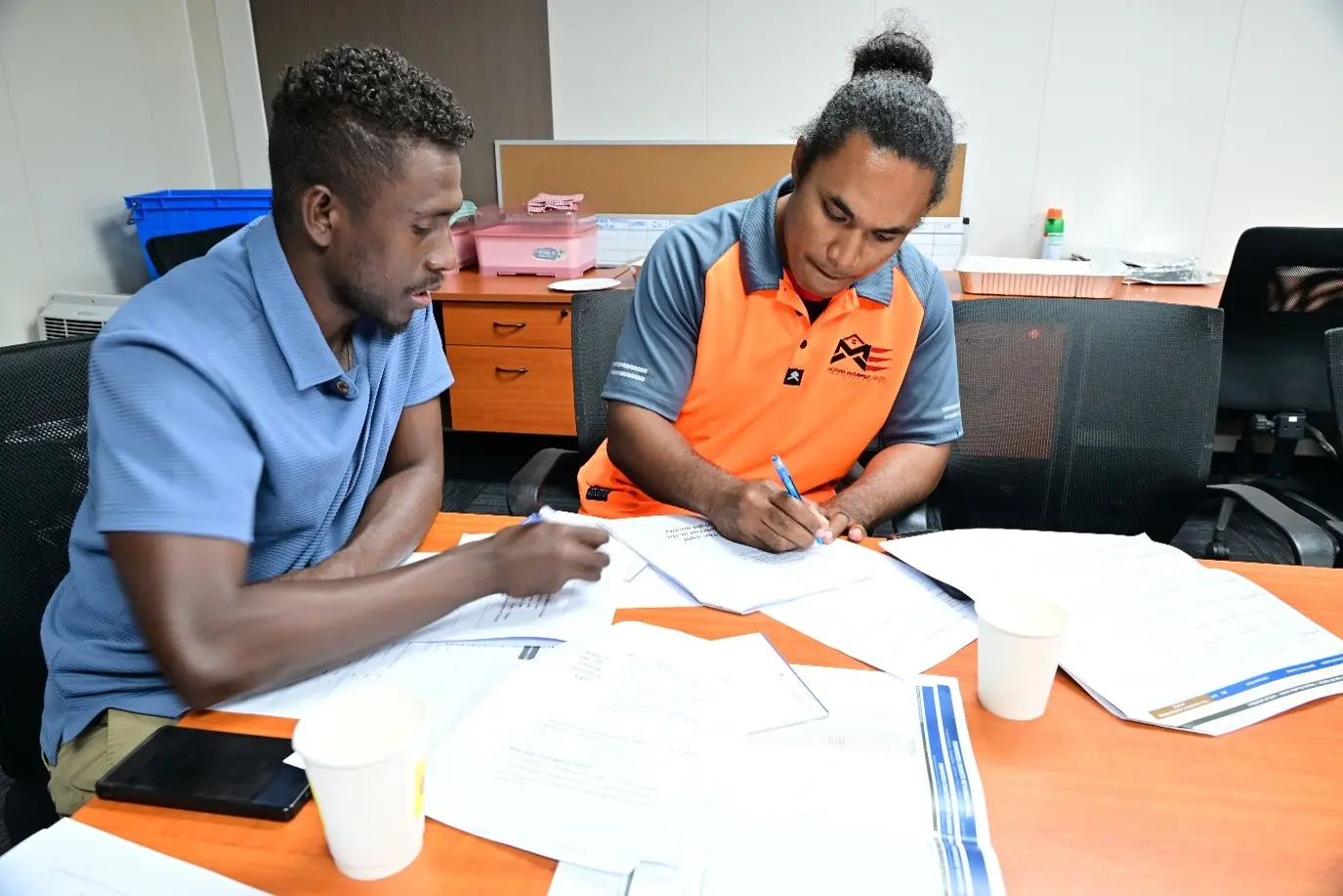 Local contractors taking part in a training session in Honiara to learn practical skills in planning and managing construction projects.
