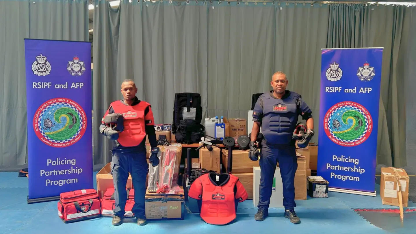 Two RSIPF OST officers demonstrate the newly donated operational safety training equipment.