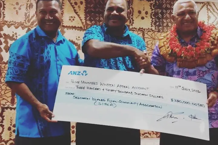 Fiji's Prime Minister, Hon. Voreqe Bainimarama (far right) and members of the Solomon Islands Fijian Community, Mr. Matai Vave (L) and Mr. Tamana Kativerata (C).