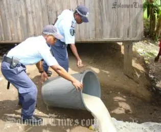 Police officers during one of many raids in attempts to stop illegal brewing of kwaso.