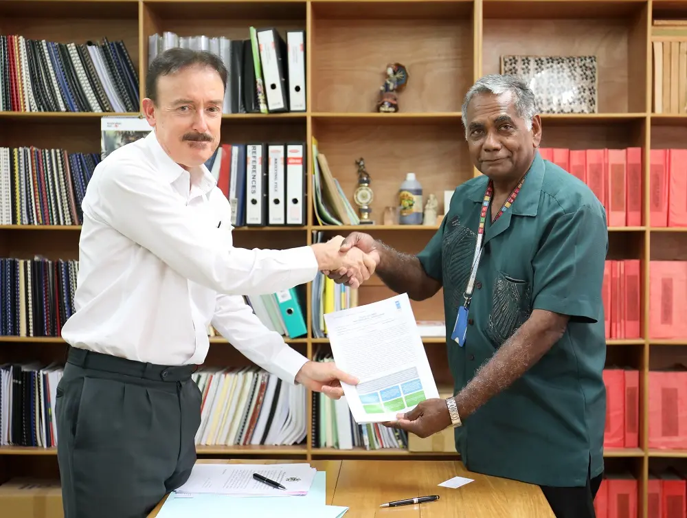 UNDP Country Manager a.i. Tony Cameron and Secretary to the Prime Minister Dr. Jimmie Rodgers approve a new anti-corruption project in Honiara on 4 July 2019.