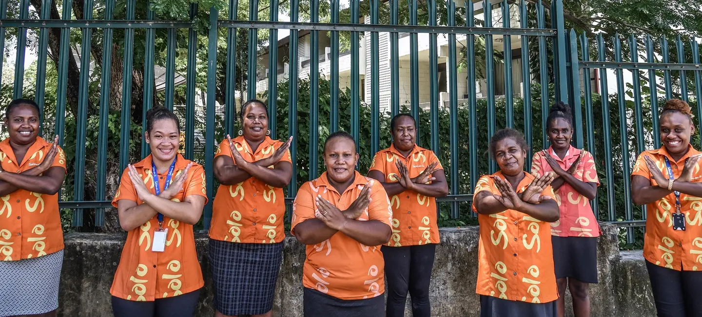 The women of Tourism Solomons making the ‘balancing for better’ sign as they celebrate International Women's Day 2022.