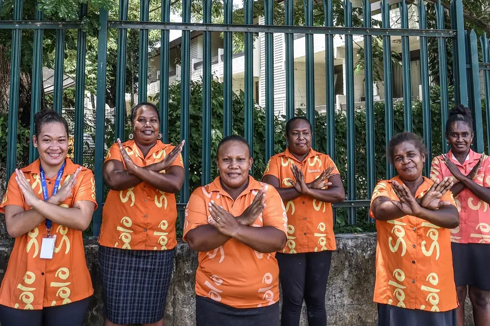 The women of Tourism Solomons making the ‘balancing for better’ sign as they celebrate International Women's Day 2022.