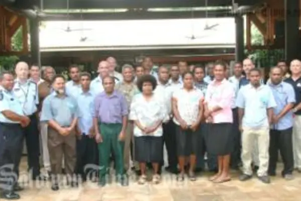 Acing Commissioner,Walter Kola (left) and Deputy Commissioner Wayne Buchhorn (2nd from left) with Workshop participants and facilitators at the Kitano Mendana Hotel.