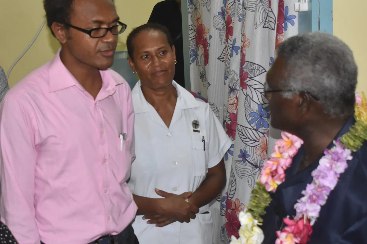 Dr Jack Siwainao talking with the Prime Minister during his visit.