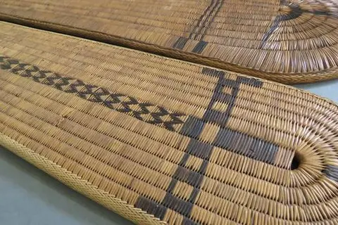 Although chiefly shields had shell and feather adornments, the most common form was more primitive and less decorative such as those in the Museum.