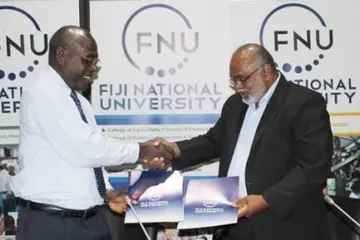SINU Vice Chacellor Dr Glynn Galo shakes hand with FNU Vice Chacellor Dr Ganesh Chand.