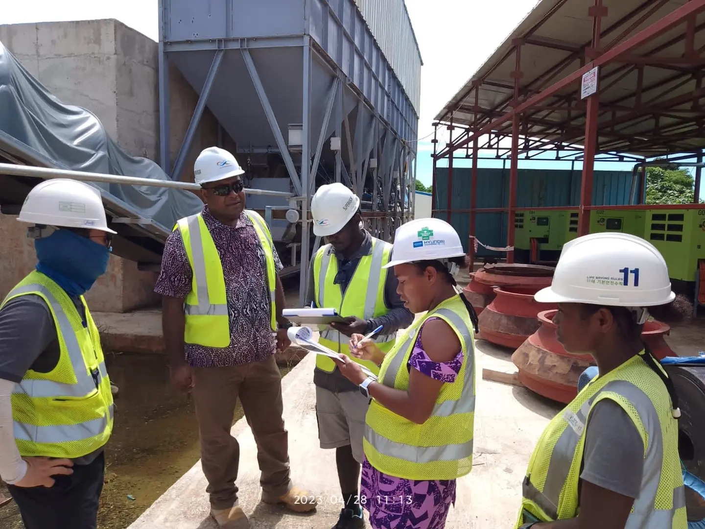 Two female Environment and Biodiversity officers of HEC actively participating in a site inspection.