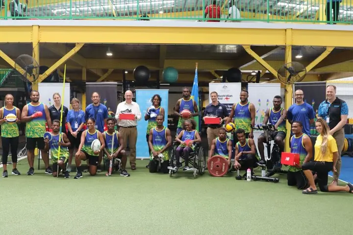 Australian High Commissioner hands over new training shoes to Solomon Islands Pacific Games athletes at SINIS.