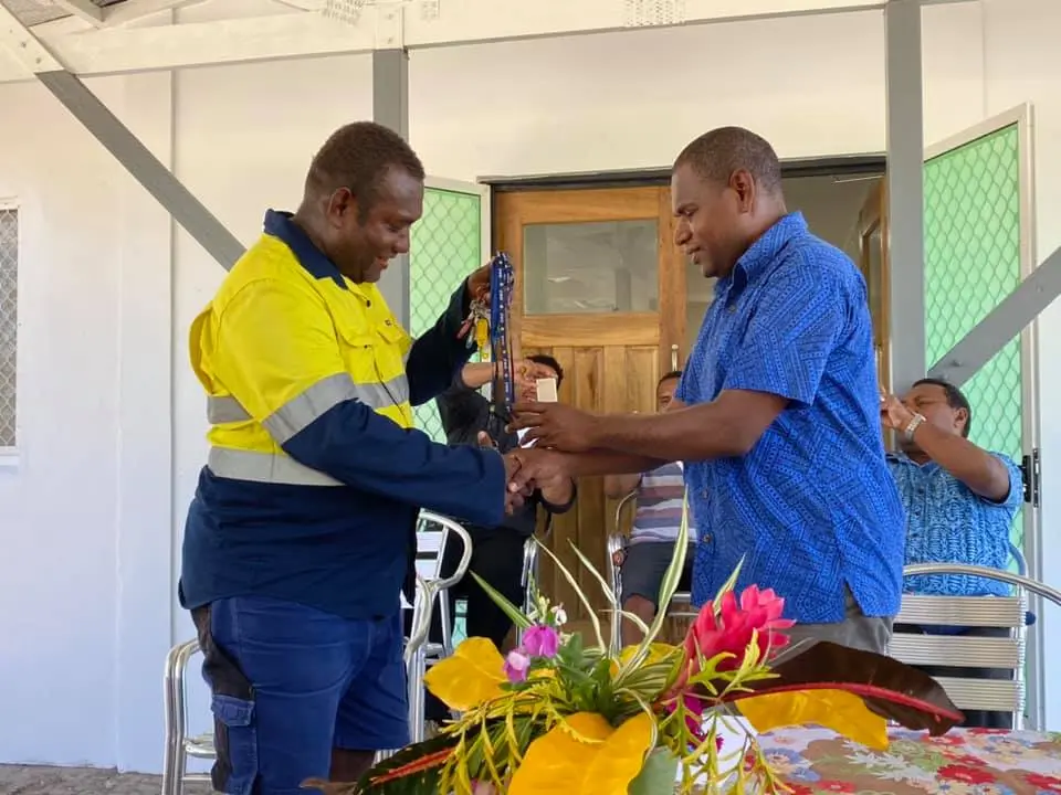 Mr Ricky George hands over keys to Mr Patterson Lusi of MFMR.