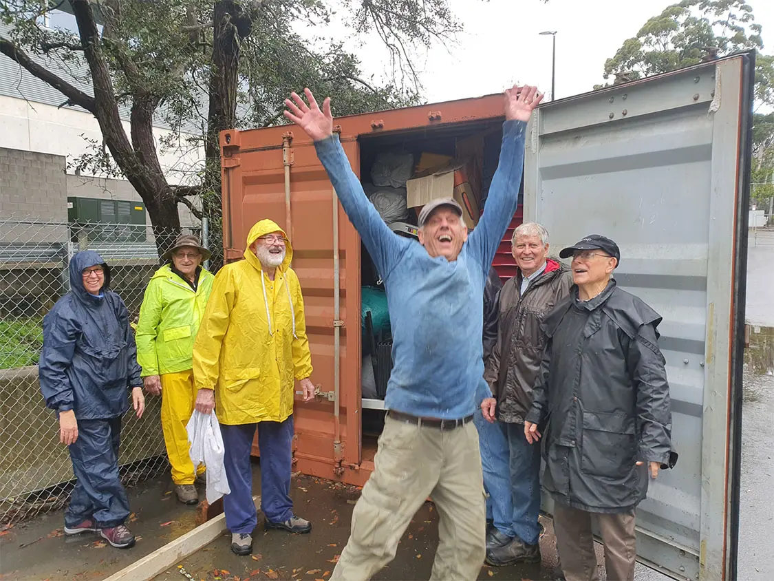 Retirees in and around Sydney collect goods for schools, clinics and hospitals which are loaded into these containers.