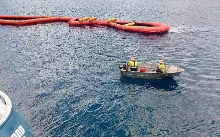 Clean up efforts after the oil spill off Rennell Island in Solomon Islands.