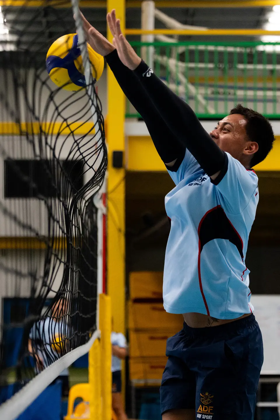 Australian Army Private Jerome Leong plays volleyball during an ADF International Sports Program in Solomon Islands.
