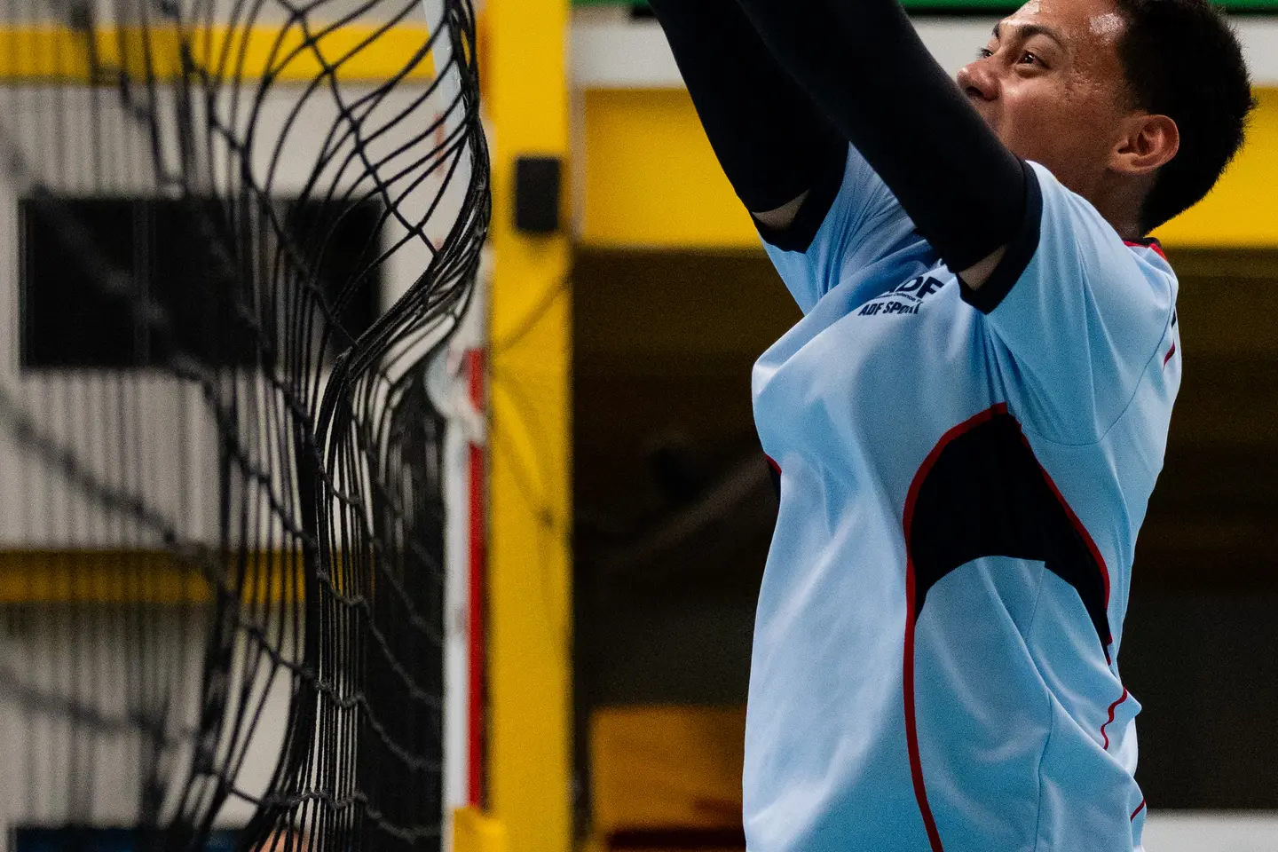 Australian Army Private Jerome Leong plays volleyball during an ADF International Sports Program in Solomon Islands.