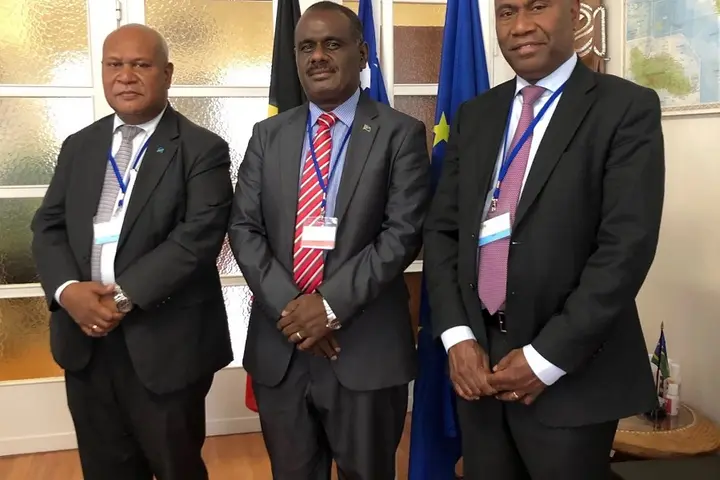 Hon. Jeremiah Manele, Minister for Foreign Affairs and External Trade [centre] at the Solomon Islands Embassy in Brussels, with Trade Commissioner Mr Joseph Ma’ahanua and Ambassador Mose.