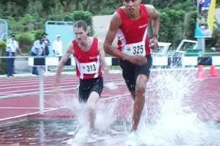 Tupuhoe Tahi and Pierre Bourret (both of Polynesie Francaise), silver and bronze medal winners in the men's 3000m steeplechase. The gold medal went to Chris Votu (Solomon Islands).