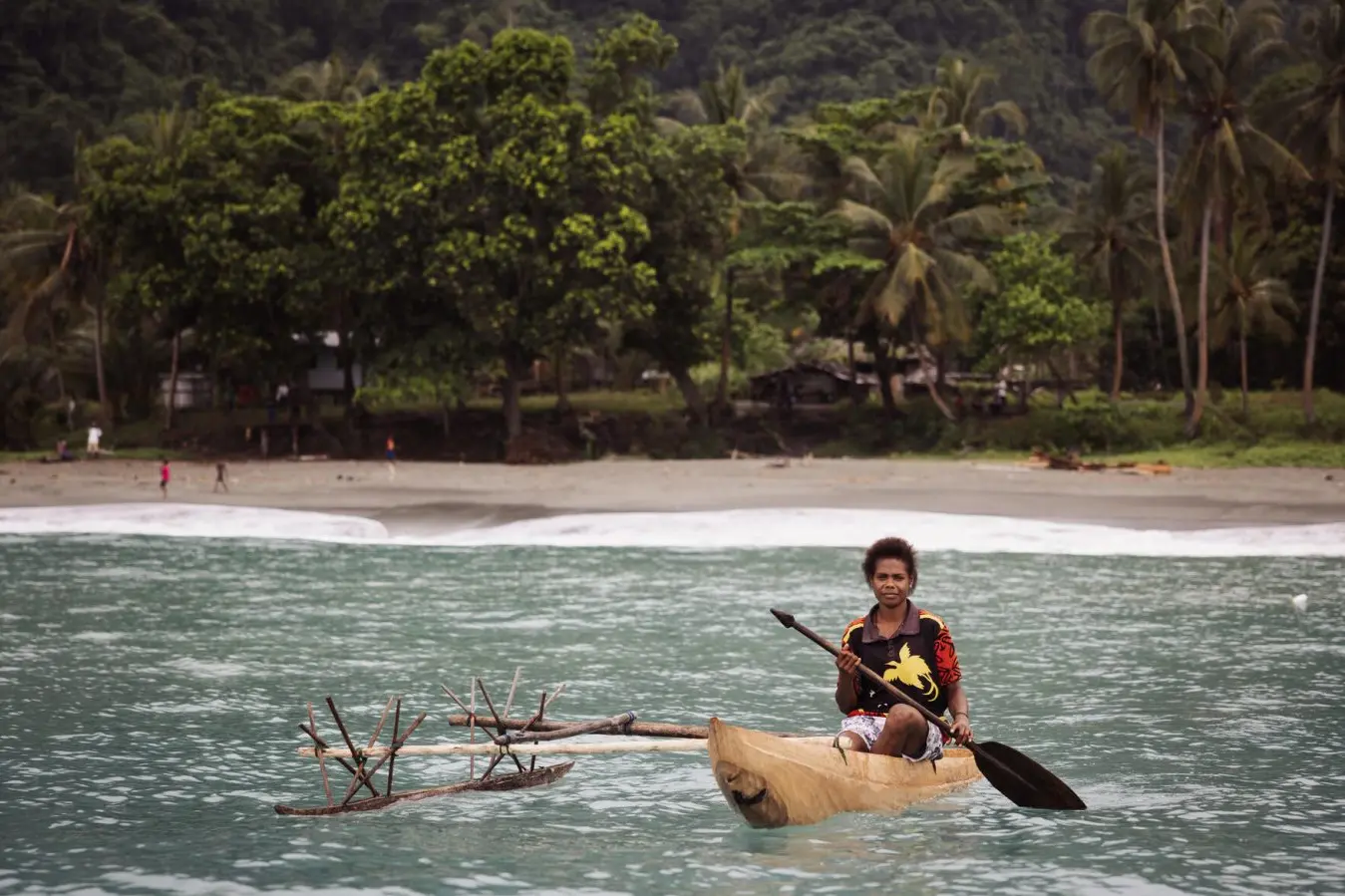 Angela, 19, fishes near her coastal community in East Sepik, Papua New Guinea