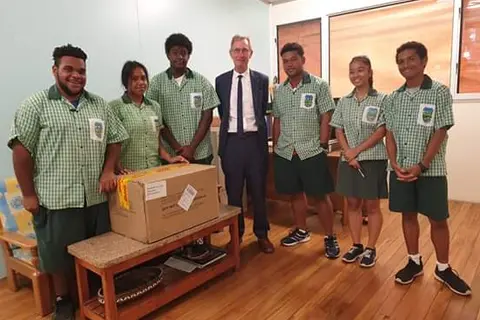 Team Solomon's and the School Principal of Woodford International School. They will represent Solomon Islands in the 2019 First Global Robotics Competition in Dubai.