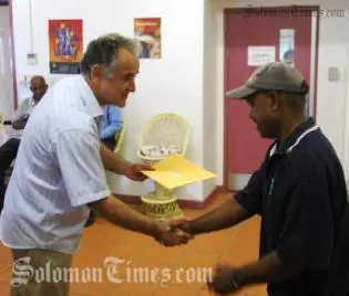 High Commissioner, Frank Ingruber, presents DAP recipient with a cheque.