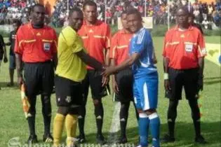 Opposing captains Jean-Robert Yelou, left, and Henry Fa'arodo exchange pleasantries before the match.