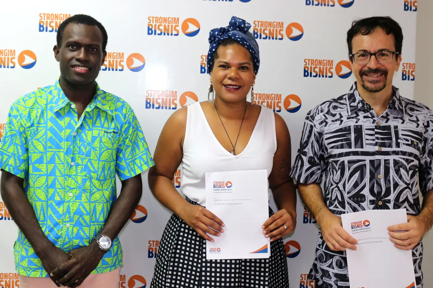 L - R: The Young Entrepreneurs Council Solomon Islands (YECSI) Coordinator, Emmanuel Pitakaka, Chairlady, Millicent Barty, Women’s Economic Empowerment and Youth Director at Strongim Bisnis, Mr Gianluca Nardi and after signing the partnership agreement to pursue the Youth Innovation Programme.