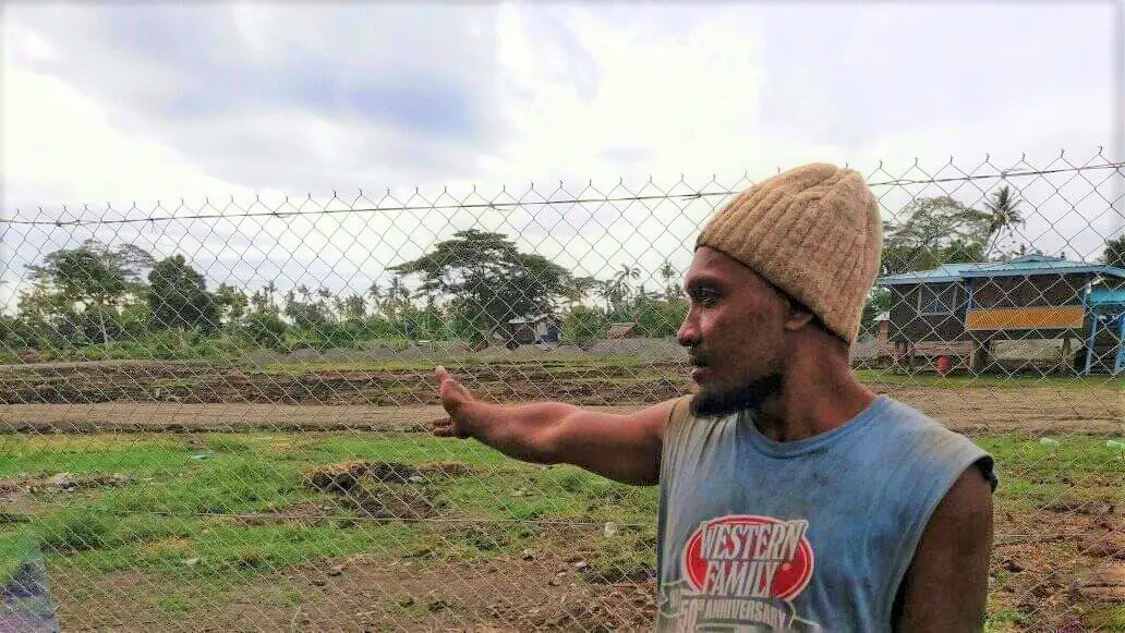 Eric points out the area where his house once stood.