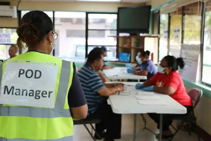 Health workers give Palau citizens their first dose of the Moderna COVID-19 vaccination.