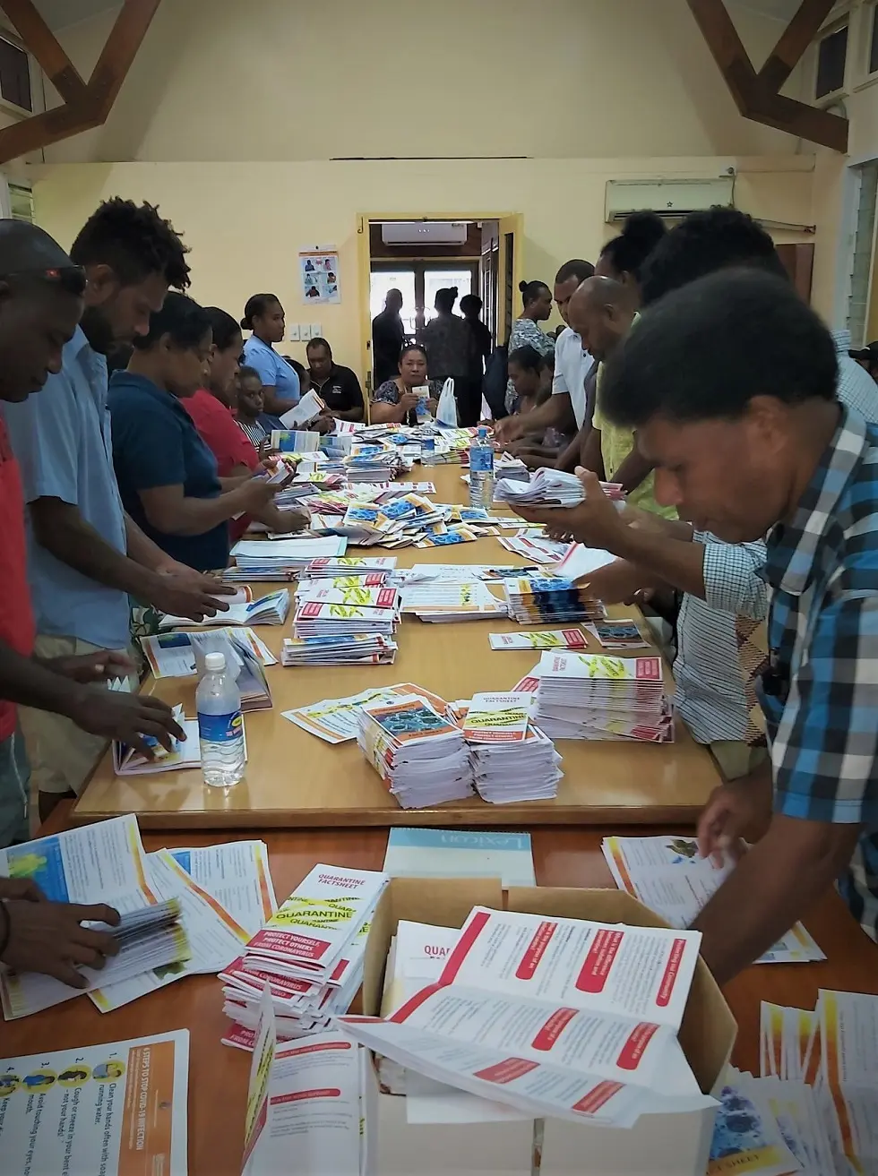 Combined efforts by MHMS and partners sorting out Covid-19 awareness materials before going to the field.