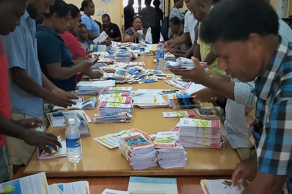 Combined efforts by MHMS and partners sorting out Covid-19 awareness materials before going to the field.